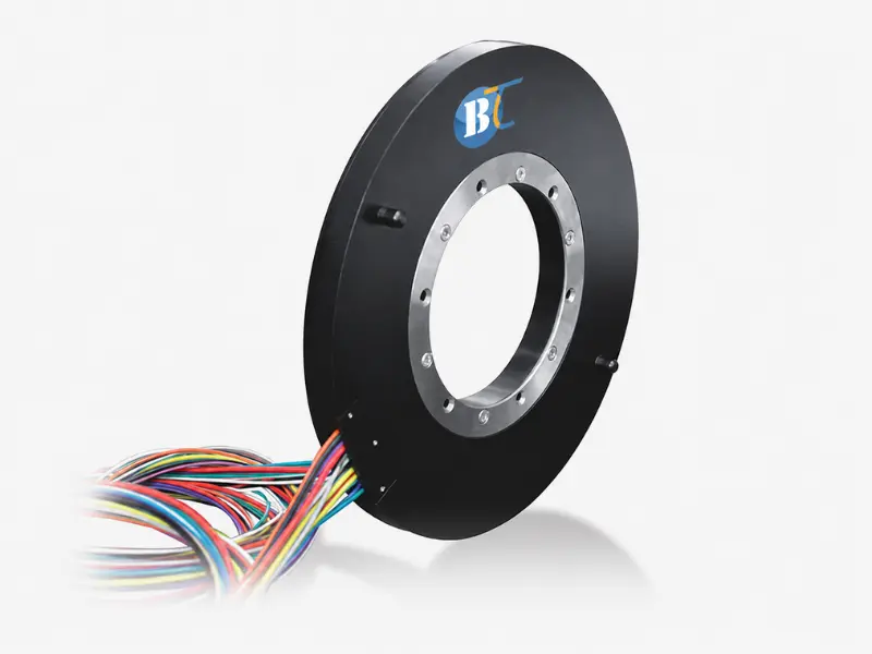 Through bore slip ring for rotating agricultural equipment Through bore slip ring for rotating agricultural equipment